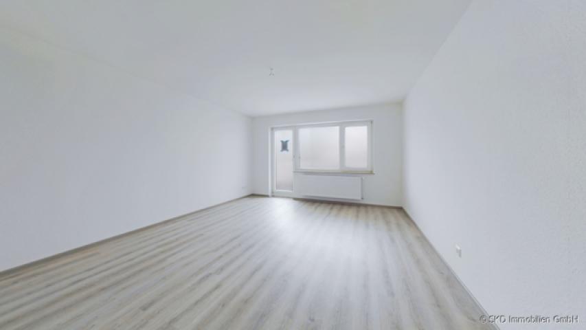 Wohnzimmer mit Balkonzugang