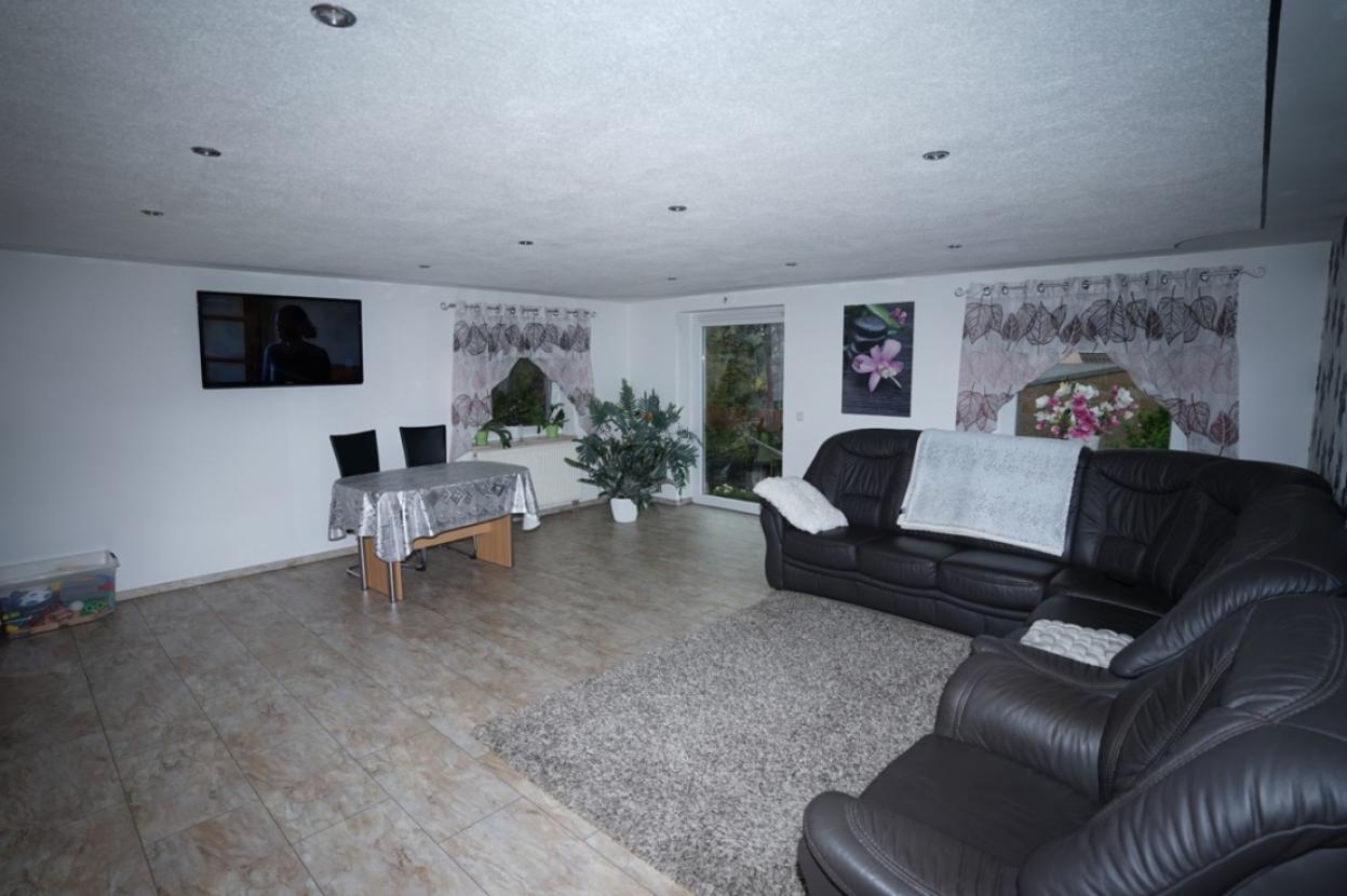 Wohnzimmer EG vermietetes Haus 1