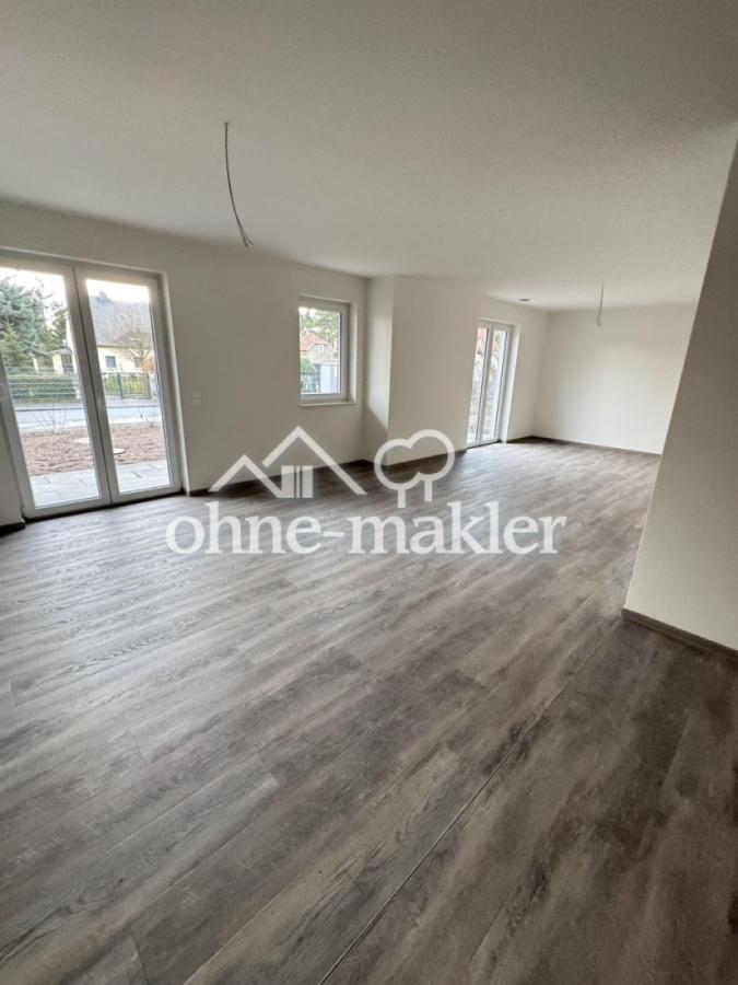 Wohnzimmer mit offener Küche