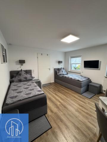 Ferienhaus WO1 links Wohnen und Schlafzimmer (1)