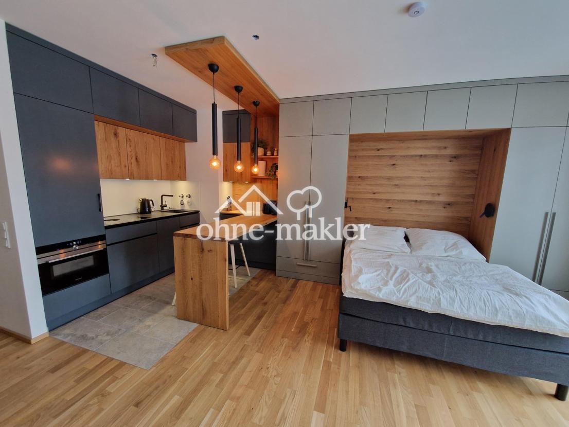 Einbauküche und Bett