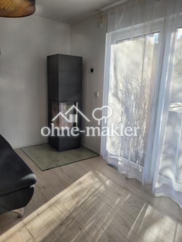 Wohnzimmer mit Kamin EG