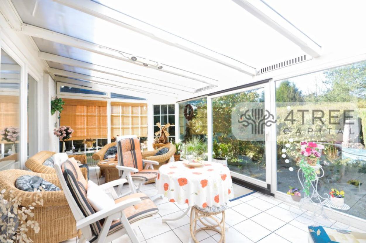 Warmwintergarten mit Terrassenzugang