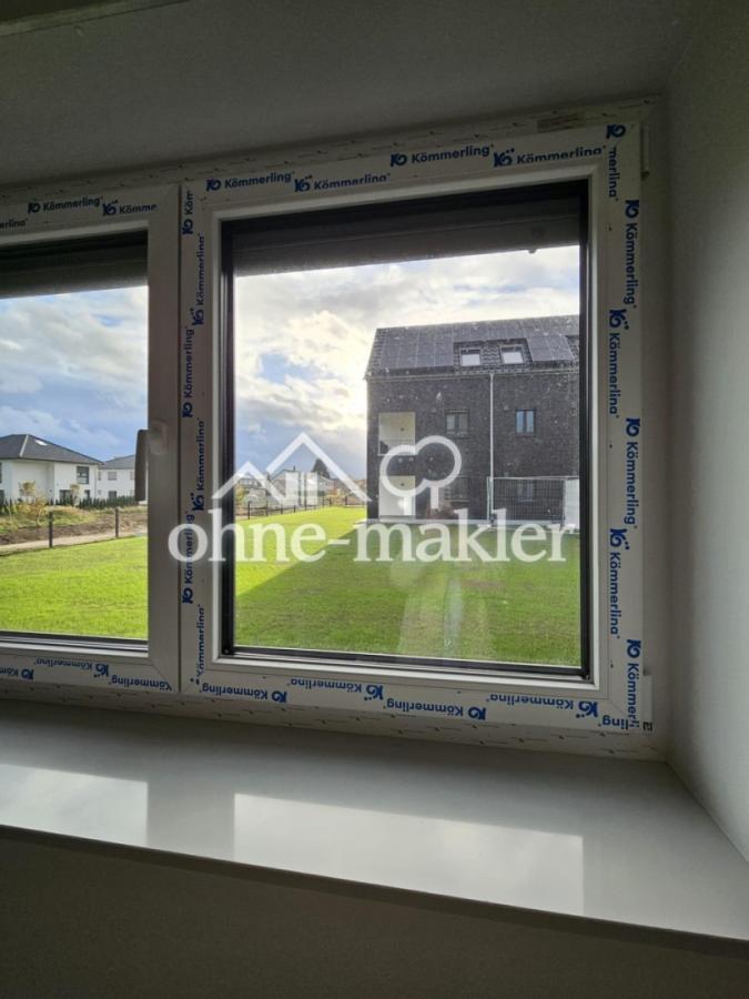 Grünfläche zwischen Häusern