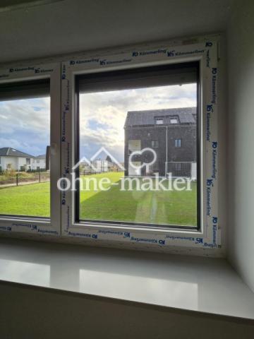 Grünfläche zwischen Häusern