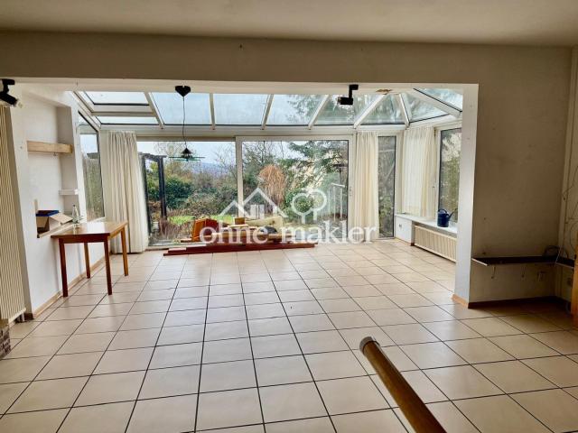 Wohnzimmer mit Wintergarten