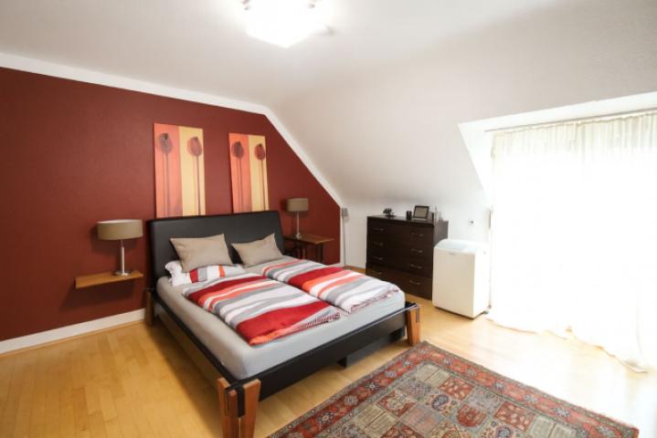 Schlafzimmer mit Balkon