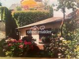 Blick aus Garten zur Terrasse