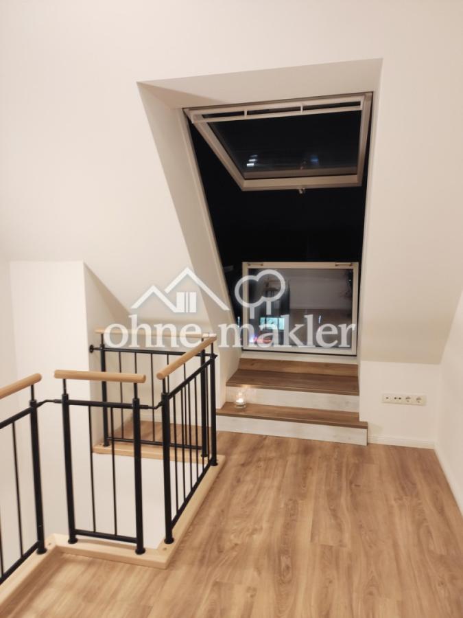 Schlafebene mit Fensterbalkon