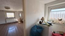 Ankleidezimmer mit Blick zum Schlafzimmer