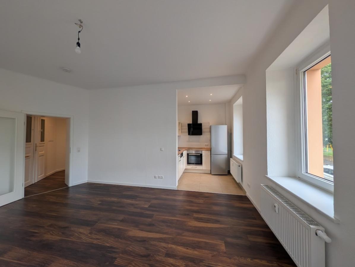 Wohnzimmer mit Küche