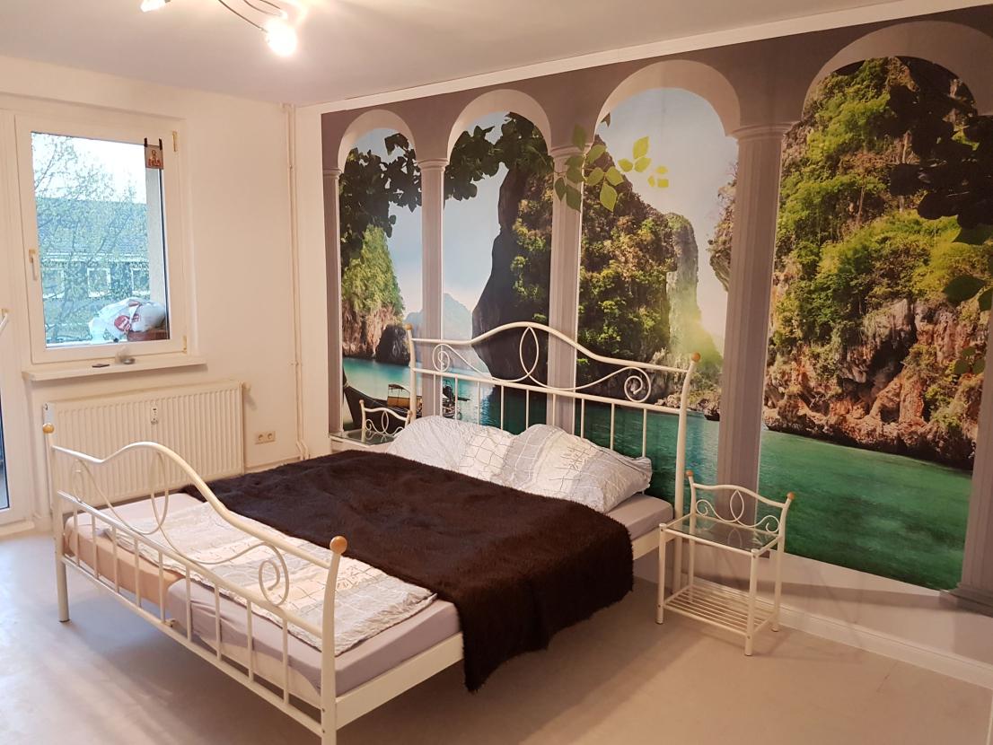 Schlafzimmer mit Balkon