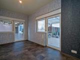 Wohnzimmer mit Zugang zur Terrasse