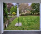 7 Blick von der Südwest-Terrasse in den der Wohnung zugeordneten Gartenanteil