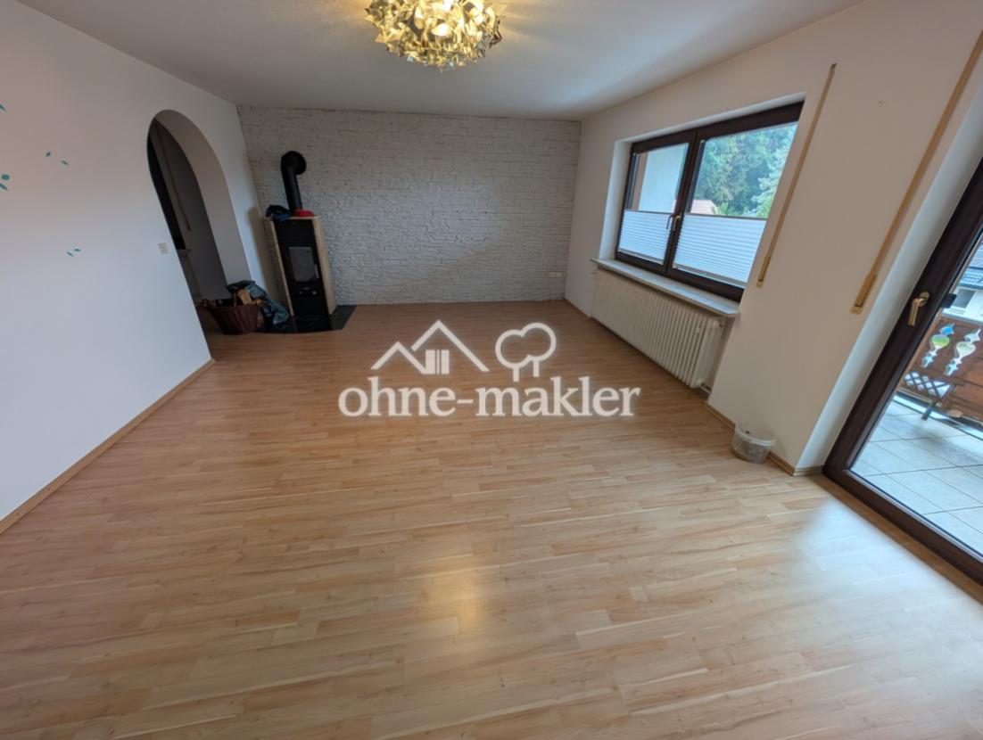 Wohnzimmer mit Kamin OG