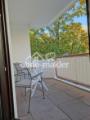 Balkon mit Blick Palmen Garten