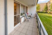 Gemütlicher Balkon mit Gartenblick